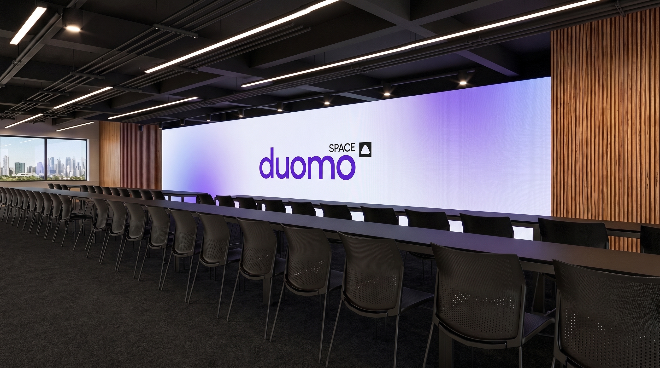 Sala de reunião do Duomo Space com iluminação em anéis e vista da cidade